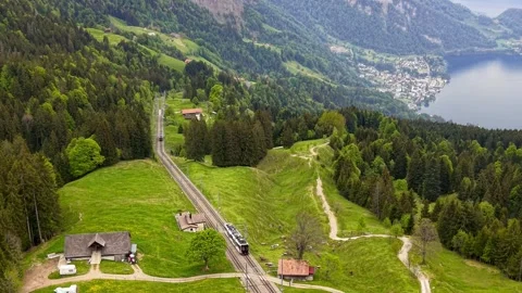 Cogwheel train climbing up Rigi mountain in Switzerland Stock Footage 340486359