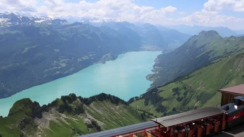Cogwheel train on top of the mountain with view of Swiss alps and lake Brienz Vidéo 279058707