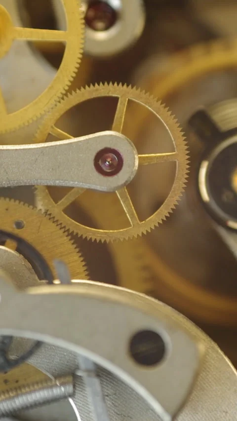 Cogwheels inside clockwork Stock Footage 300906906