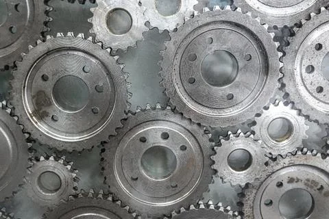 Cogwheels machinery , engineering and industry or concepts such as teamwork a Stock Photos
