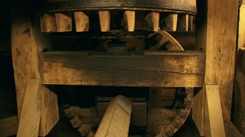 Cogwheels rotate in a 90-degree angle in an industrial corn mill Stock Footage 73276858