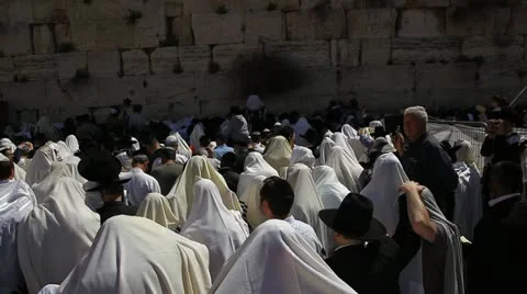Cohanim raise their hands during Priestly Blessing at the Western Wall Stock Footage 22306161