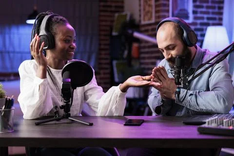 Cohosts presenting entertaining show Stock Photos