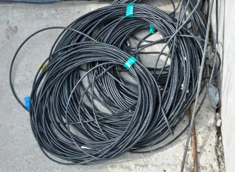 The coil of black electrical cable Stock Photos