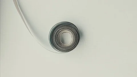 Coil of paper rotating stop motion Stock Footage 80899653