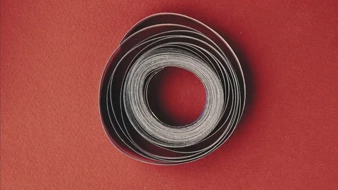 Coil of paper rotating stop motion Stock Footage 80899680