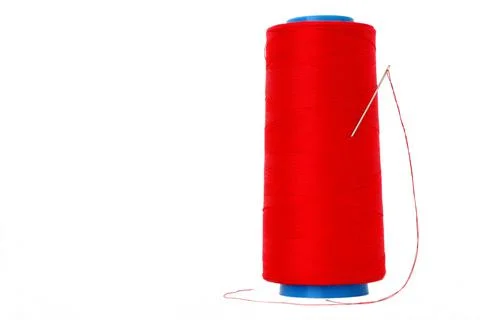 The coil with red threads and a needle Stock Photos