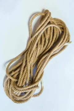 A coil of rope on a white background. Stock Photos