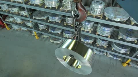 Coil of strip steel hooked on a underslung crane Stock Footage 11899300