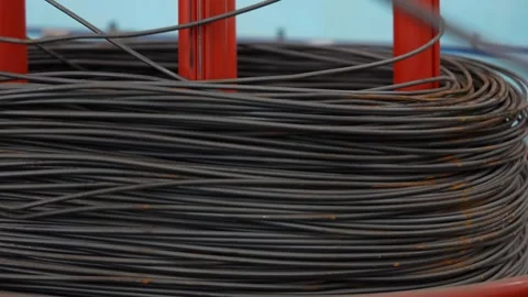 Coil with wire for Automatic universal wire bending machine. Stock Footage 263579517