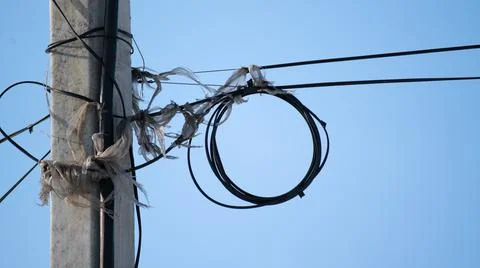 A coil of wire on a pole Stock Photos