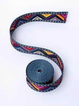 Coiled black and orange pattern trim ribbon Stock Photos