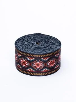 Coiled black and red pattern trim ribbon Stock Photos