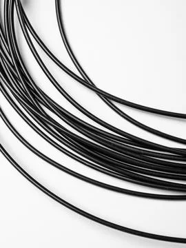 Coiled black cords studio shot variant Stock Photos