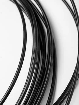Coiled black cords studio shot variant two Stock Photos