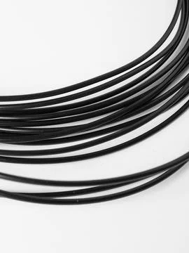 Coiled black cords studio shot Stock Photos