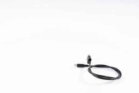 Coiled Black USB-C Cable on White Background Stock Photos