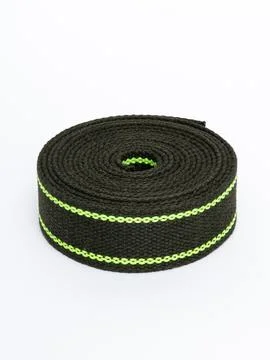 Coiled black webbing strap with green stripe variant five Stock Photos