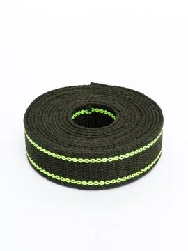 Coiled black webbing strap with green stripe variant four Stock Photos