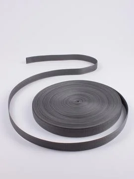 Coiled black webbing strap studio shot Stock Photos