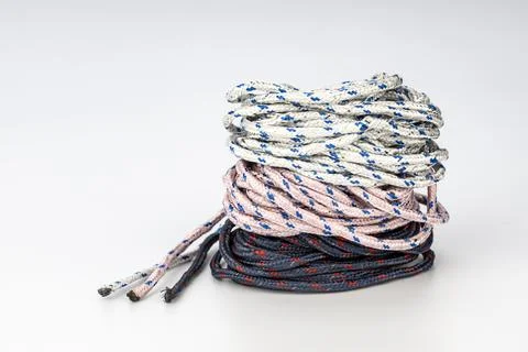 Coiled Braided Rope Stack in Multiple Colors on White Background Stock Photos