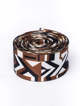 Coiled brown geometric pattern trim ribbon Stock Photos