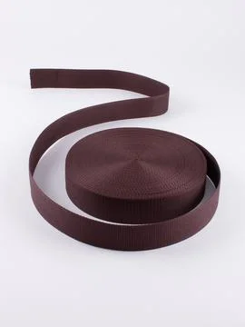 Coiled brown webbing strap studio shot Stock Photos