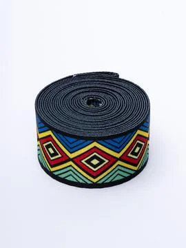 Coiled colorful aztec pattern trim ribbon variant Stock Photos
