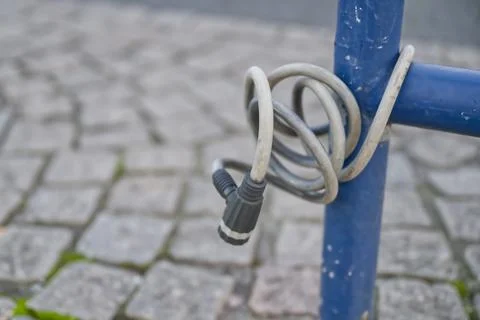 Coiled Electrical Cable on Blue Pole Stock Photos