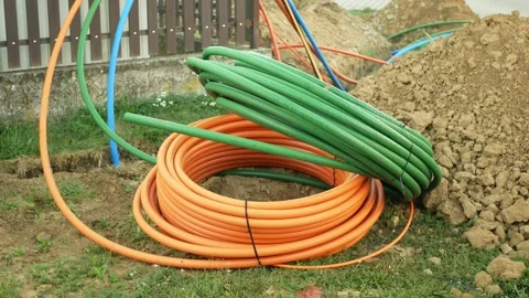 Coiled fiber optic optical cables internet networks silica glass fiber laying Stock Footage 345651019