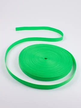 Coiled green webbing strap studio shot variant four Stock Photos
