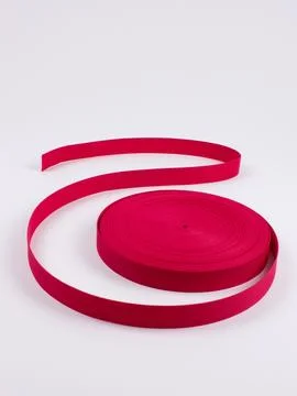 Coiled magenta webbing strap studio shot Stock Photos