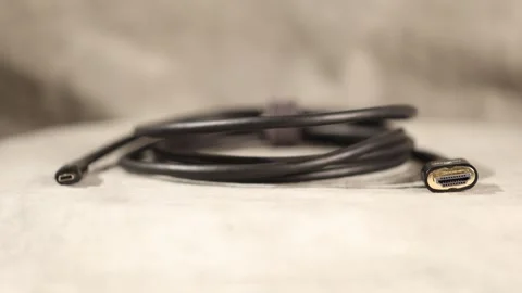 Coiled Mini Micro HDMI to HDMI Cable on Display Video stock 295800130