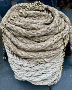 Coiled Mooring Rope on Ship Deck. Maritime Equipment for Vessel Operations Stock Photos