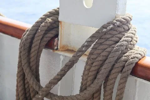 Coiled Nautical Rope on Ship Railing 스톡 사진