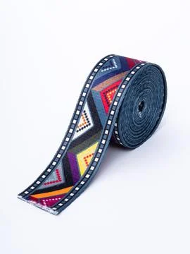 Coiled navy aztec pattern trim ribbon Stock Photos