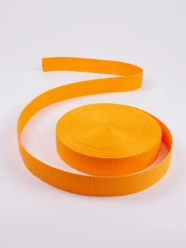 Coiled orange webbing strap studio shot variant five Stock Photos