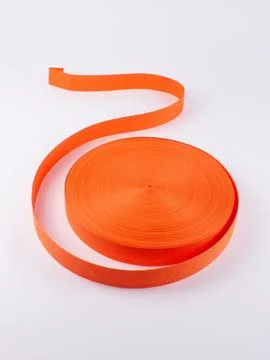 Coiled orange webbing strap studio shot variant three Stock Photos