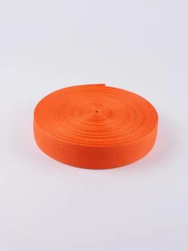 Coiled orange webbing strap studio shot variant Stock Photos