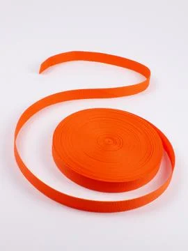 Coiled orange webbing strap studio shot variant two Stock Photos