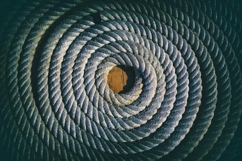 Coiled rope on boat deck. Stock Photos