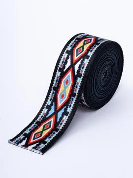 Coiled teal floral pattern trim ribbon Stock Photos