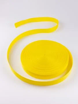 Coiled yellow webbing strap studio shot variant two Stock Photos