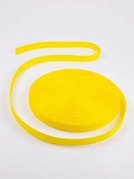 Coiled yellow webbing strap studio shot 스톡 사진