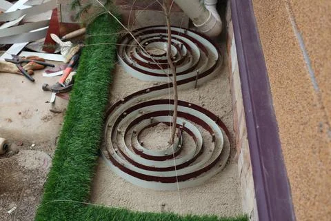 The coiling of the ion wires when forming the home garden Stock Photos