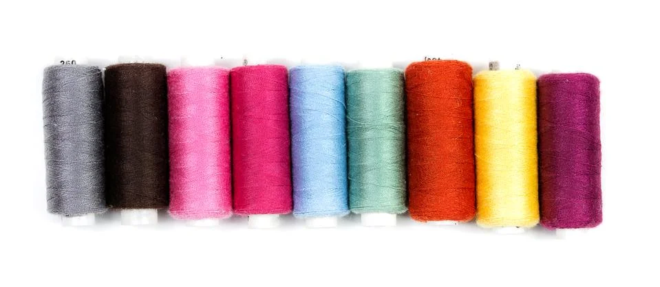 Coils of colored thread on a white background Stock Photos