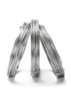 Coils of galvanized wires standing Stock Photos
