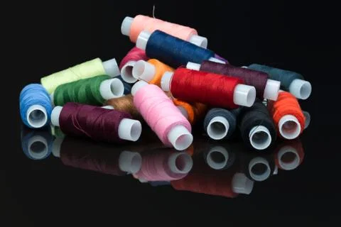 Coils with multi-colored sewing threads Stock Photos