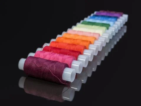 Coils with multi-colored sewing threads Stock Photos