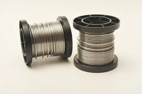 Coils with solder. Plastic coils with tin-lead solder. Materials for electr.. Stock Photos